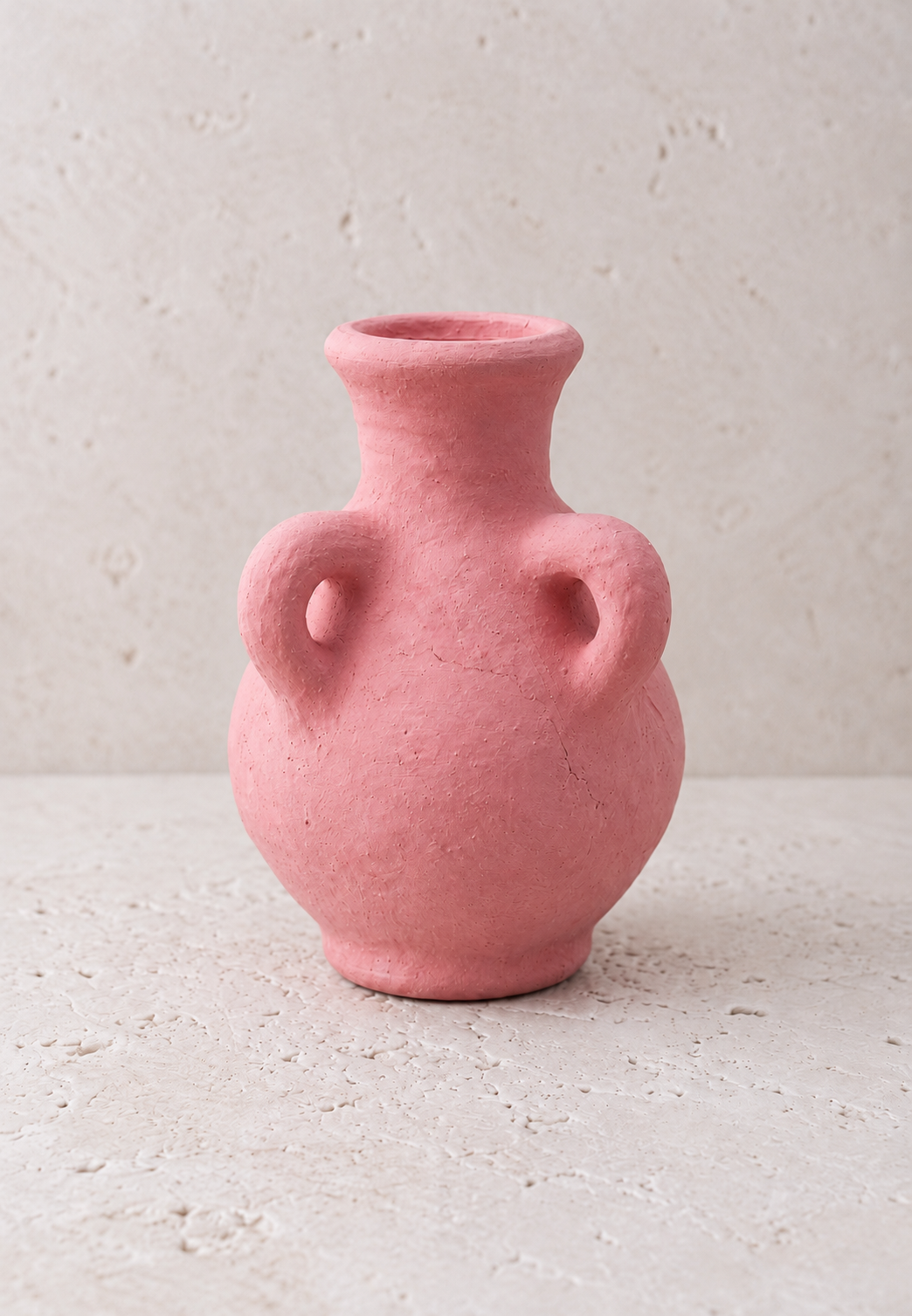 Coral pink amphora vase styled with dried branches