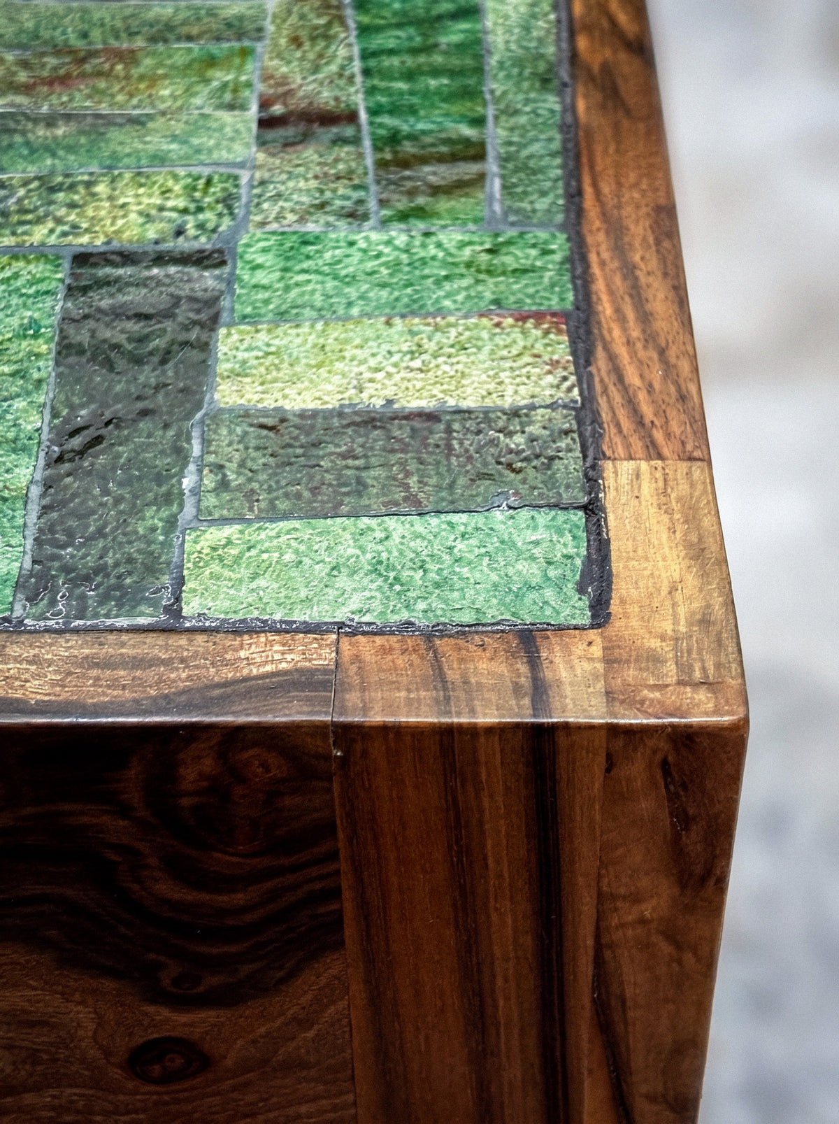 Sculptural walnut table, side view showing the grain of the solid wood