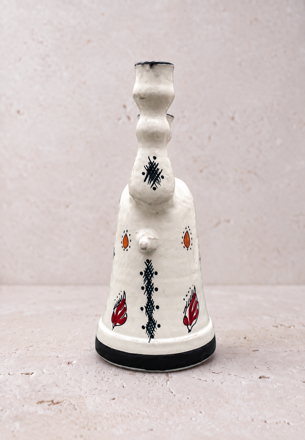 Riad double-neck vase styled with single stems in a minimalist interior